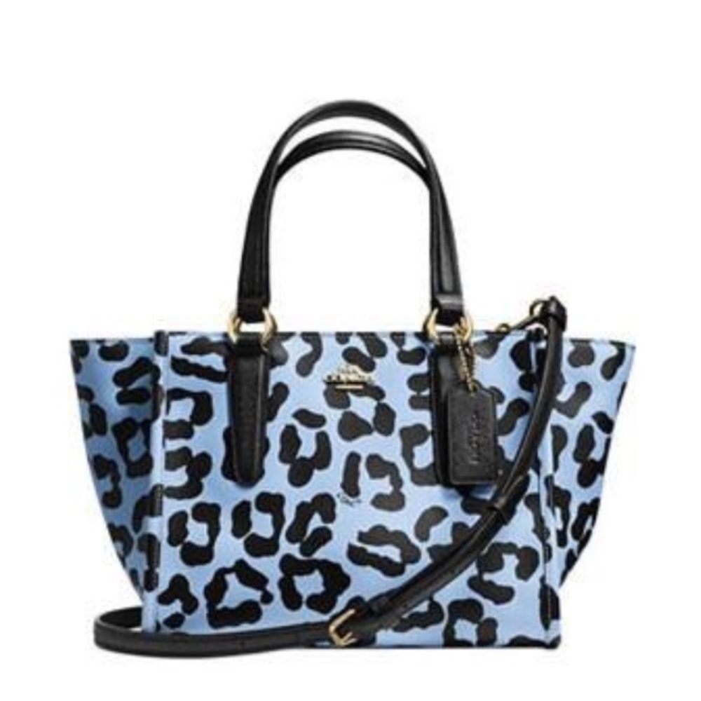 Adorable powder blue printed coach bag.